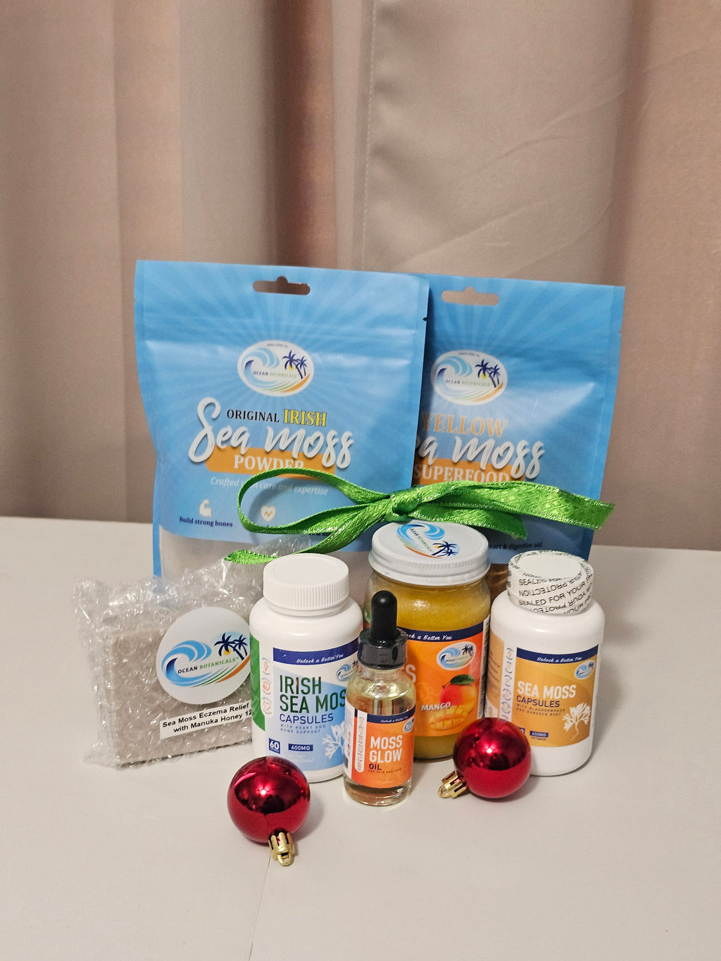 Collection of sea moss products on a beige surface