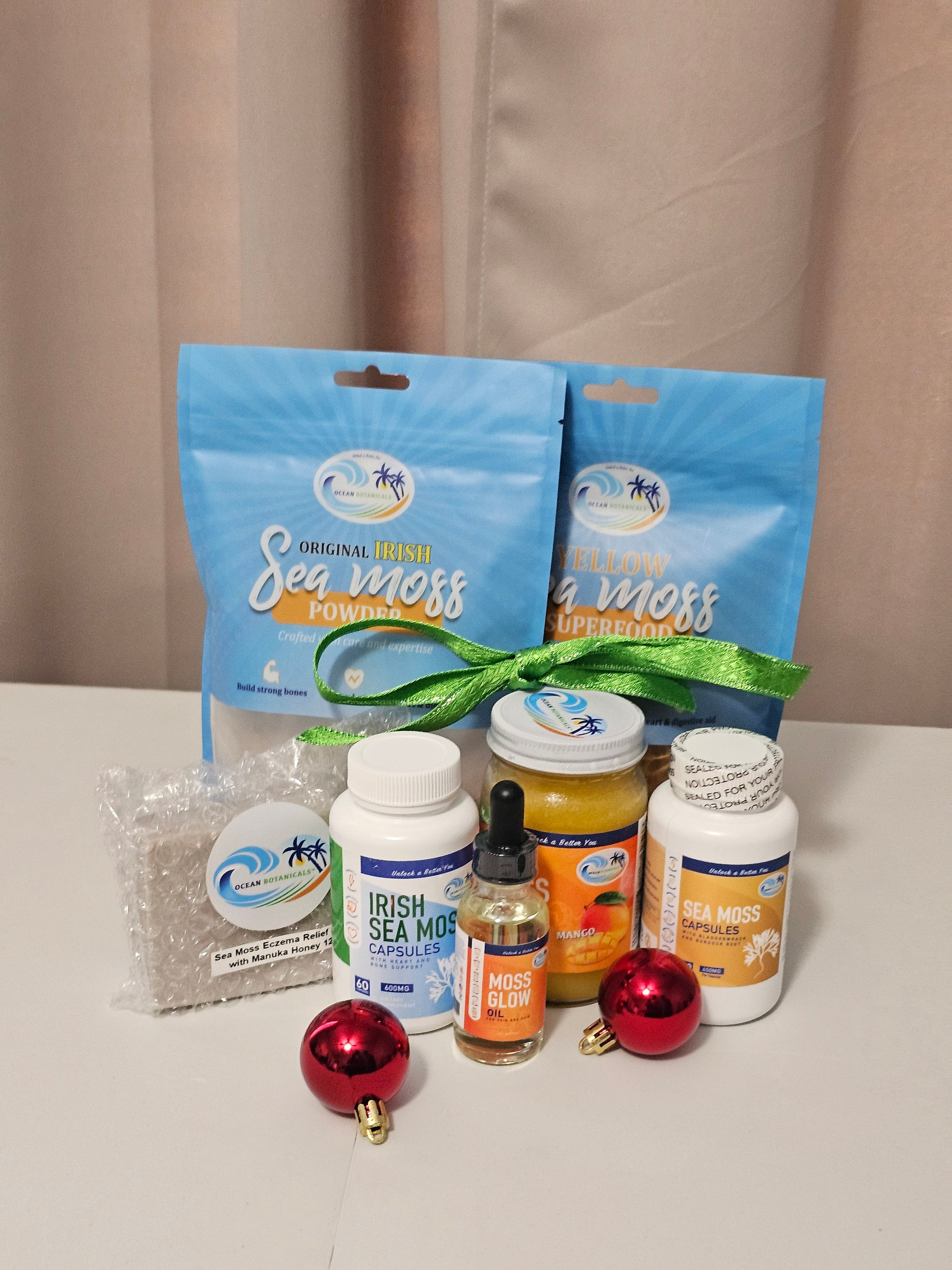 Collection of sea moss products on a beige surface